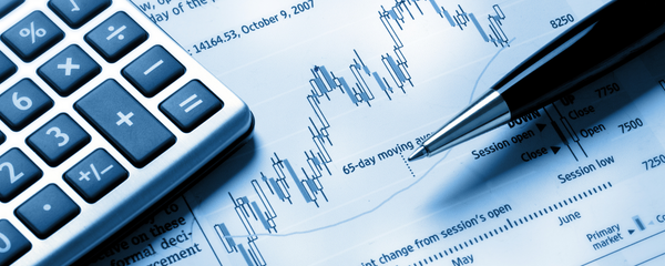A pen and calculator representing financial risk and assessment.